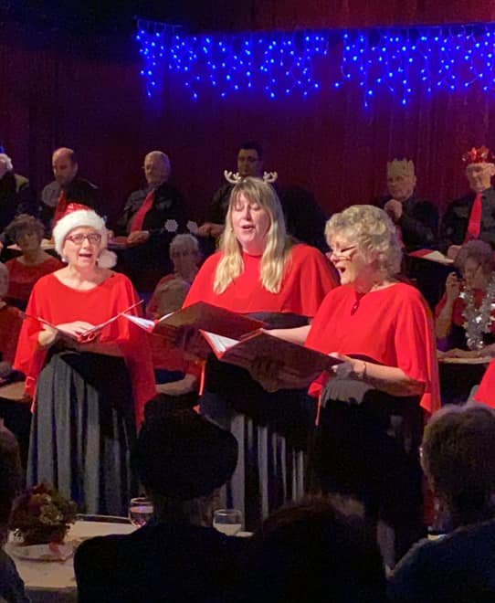 Helen Pearce, Abby Evans and Fran Brightman sing two well-known Christmas songs at the Steventon Choral Society's Christmas Concert in December 2019